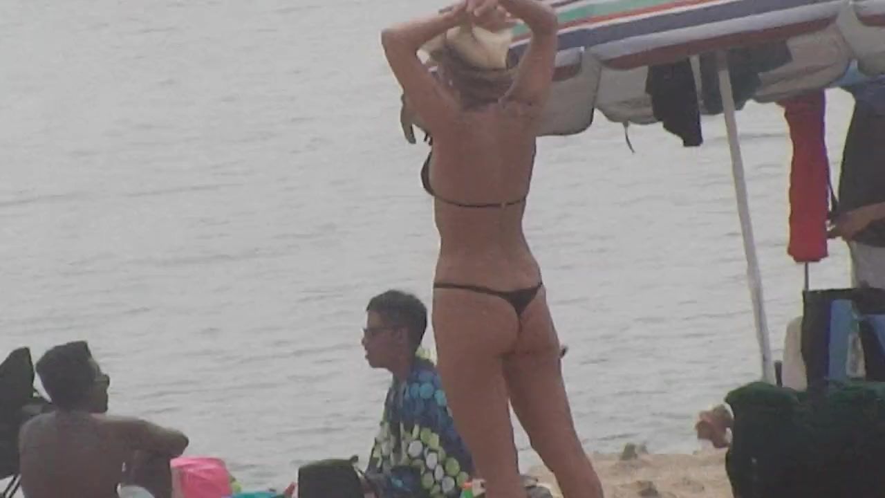 Hot curvy MILF on the beach